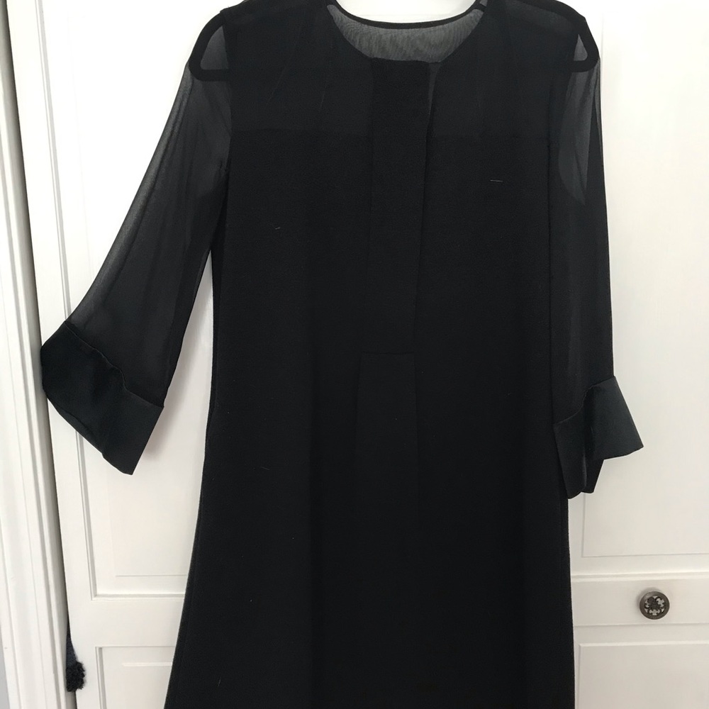 Black sheer sleeve knee slightly below dress